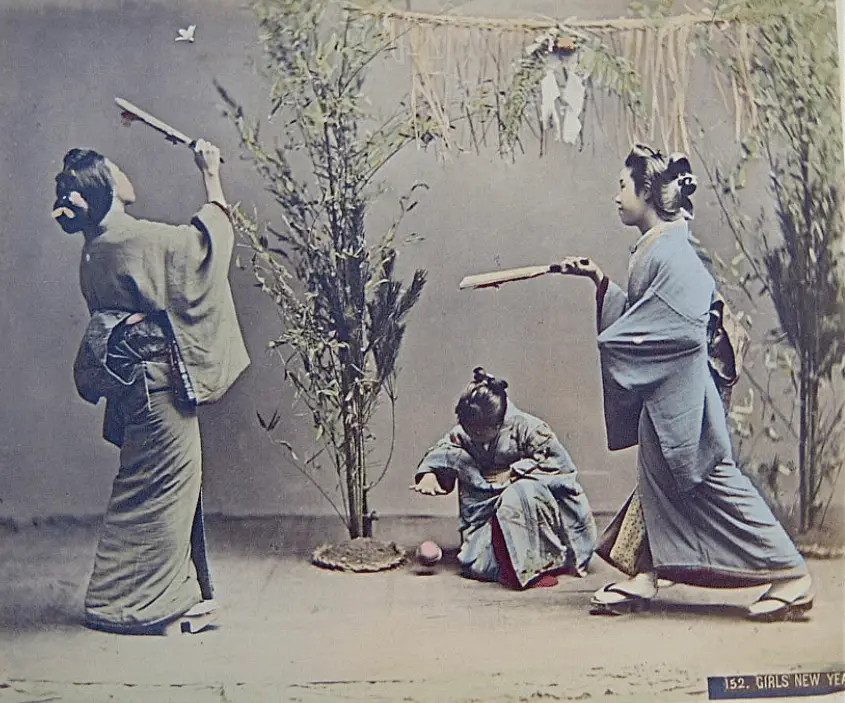 girls playing hanetsuki during new year